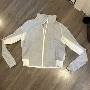 Lululemon jacket, size 12, mesh back, thumb holes, and zipper pockets